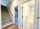 Hallway with access to stairs, a bedroom with carpet, and a bathroom with tile flooring, showing layout at 3850 Willow Grove Ln # 24, Concord, NC 28025