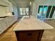 Close up view of kitchen island with seating, sink and modern fixtures at 3850 Willow Grove Ln # 24, Concord, NC 28025