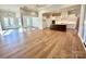 Open-concept living space with hardwood floors and ample natural light at 3850 Willow Grove Ln # 24, Concord, NC 28025