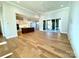 Open-concept living space features hardwood floors, kitchen view, and sliding glass doors at 3850 Willow Grove Ln # 24, Concord, NC 28025