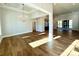Spacious living room with hardwood floors, modern lighting, and sliding glass doors at 3850 Willow Grove Ln # 24, Concord, NC 28025
