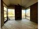 Rear porch with a ceiling fan, fireplace, railings, and outdoor access at 3850 Willow Grove Ln # 24, Concord, NC 28025