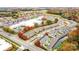 Aerial view of townhomes and surrounding area with retail, businesses, and colorful foliage at 5527 Stafford Rd # 34, Charlotte, NC 28215