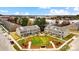 Aerial view of new townhomes featuring a central lawn, manicured landscaping, and communal mailboxes at 5527 Stafford Rd # 34, Charlotte, NC 28215