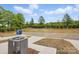 Exterior backyard view showing grass, sidewalks, and landscaping at 5527 Stafford Rd # 34, Charlotte, NC 28215