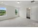 Bright bedroom with two large windows and ensuite bathroom access at 5527 Stafford Rd # 34, Charlotte, NC 28215