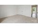Bedroom with neutral carpet and paint, as well as closet for storage at 5527 Stafford Rd # 34, Charlotte, NC 28215