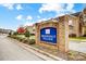 Brookdale Village community sign is surrounded by beautiful landscaping on a tree-lined street at 5527 Stafford Rd # 34, Charlotte, NC 28215