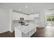 Modern kitchen with white cabinetry, stainless steel appliances, and a large island at 5527 Stafford Rd # 34, Charlotte, NC 28215