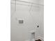 The laundry room features water hookups, electrical outlets, and clean white walls at 5527 Stafford Rd # 34, Charlotte, NC 28215