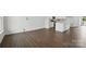 Open-concept living space with modern kitchen and hardwood floors at 5527 Stafford Rd # 34, Charlotte, NC 28215
