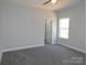 A bright bedroom with neutral walls and carpet; filled with natural light from the window at 1647 Davis Farm Rd, York, SC 29745