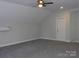 Spacious bonus room with neutral walls and gray carpeting at 1647 Davis Farm Rd, York, SC 29745