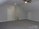 Bright bonus room features a ceiling fan and gray carpeting at 1647 Davis Farm Rd, York, SC 29745