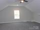 Spacious bonus room featuring a window, ceiling fan, and neutral carpet and paint at 1647 Davis Farm Rd, York, SC 29745