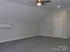 Well lit bonus room features gray carpeting and neutral walls at 1647 Davis Farm Rd, York, SC 29745