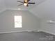 Spacious bonus room featuring a window, ceiling fan, and neutral carpet and paint at 1647 Davis Farm Rd, York, SC 29745