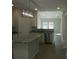 Modern kitchen featuring white cabinets, granite countertops, stainless steel appliances, and a functional kitchen island at 1647 Davis Farm Rd, York, SC 29745