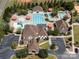 Aerial view of community clubhouse featuring a pool, splash area, and well-maintained landscaping at 1716 Funny Cide Dr, Waxhaw, NC 28173