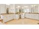 Spacious bathroom featuring dual vanities, granite countertops, a makeup vanity, and large mirrors at 1716 Funny Cide Dr, Waxhaw, NC 28173