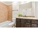 Well-lit bathroom with a tub, shower, dark vanity, and granite countertops at 1716 Funny Cide Dr, Waxhaw, NC 28173