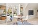 A bonus room nook with bright sunlight streaming in the windows and built in shelving at 1716 Funny Cide Dr, Waxhaw, NC 28173