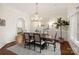Formal dining room with chandelier, large window, and hardwood floors at 1716 Funny Cide Dr, Waxhaw, NC 28173