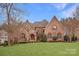 Stunning brick and stone residence boasts mature landscaping and impressive architectural details at 1716 Funny Cide Dr, Waxhaw, NC 28173