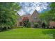 Charming brick home with a beautiful landscaped front yard and architectural details at 1716 Funny Cide Dr, Waxhaw, NC 28173