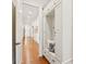 Hallway with wooden floors, recessed lighting, and a built-in bench at 1716 Funny Cide Dr, Waxhaw, NC 28173