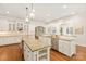 Spacious kitchen features custom cabinets, granite countertops and modern stainless steel appliances at 1716 Funny Cide Dr, Waxhaw, NC 28173