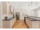 Modern kitchen with white cabinetry, stainless steel appliances, and granite countertops at 1716 Funny Cide Dr, Waxhaw, NC 28173