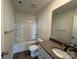 Bathroom with bathtub, granite vanity and vinyl plank flooring at 174 Salem Springs Ln, Statesville, NC 28625