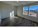 Bright bedroom with large windows and vinyl plank flooring at 174 Salem Springs Ln, Statesville, NC 28625