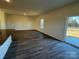 Living room with vinyl flooring and sliding glass door at 174 Salem Springs Ln, Statesville, NC 28625