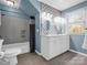 Stylish bathroom featuring a double sink vanity, tub-shower, and modern fixtures at 204 Jonas Dr, Lincolnton, NC 28092