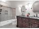Modern bathroom featuring double vanity, granite counters, and a walk-in shower at 204 Jonas Dr, Lincolnton, NC 28092