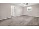 Neutral bedroom with a ceiling fan and a window with white curtain at 204 Jonas Dr, Lincolnton, NC 28092