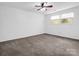Bright bedroom with carpet, a ceiling fan, and two windows at 204 Jonas Dr, Lincolnton, NC 28092