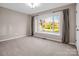 Bedroom featuring a large window and neutral carpeting at 204 Jonas Dr, Lincolnton, NC 28092