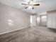 Spacious bedroom with ceiling fan, soft carpet, and a walk-in closet at 204 Jonas Dr, Lincolnton, NC 28092