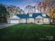 Beautiful single-story brick home with dormers, an attached garage, and a well-manicured lawn at 204 Jonas Dr, Lincolnton, NC 28092