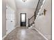 Welcoming foyer with tile flooring, staircase, and front door with decorative glass panel at 204 Jonas Dr, Lincolnton, NC 28092