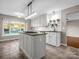 Stylish kitchen with granite countertops, island with cooktop, and white cabinetry at 204 Jonas Dr, Lincolnton, NC 28092