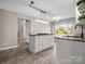 Modern kitchen with granite countertops, island with cooktop, and bright breakfast nook at 204 Jonas Dr, Lincolnton, NC 28092