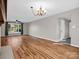 Bright and airy living room with hardwood floors, ceiling fan, and large windows at 204 Jonas Dr, Lincolnton, NC 28092