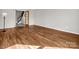 Bright and open living room with hardwood floors and French doors to other parts of the house at 204 Jonas Dr, Lincolnton, NC 28092