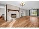 Spacious living room featuring hardwood floors, fireplace with mantel, and plenty of natural light at 204 Jonas Dr, Lincolnton, NC 28092
