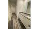 Modern bathroom featuring dual sinks, granite countertop and hardwood floors at 282 New Salem Rd, Statesville, NC 28625