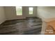 Spacious bedroom featuring modern luxury vinyl plank flooring and natural light at 282 New Salem Rd, Statesville, NC 28625